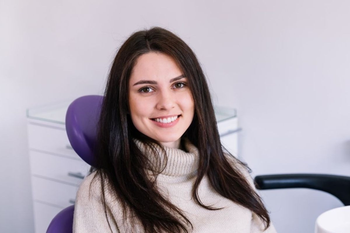 Patient smiling during her first dental visit in Round Rock, TX