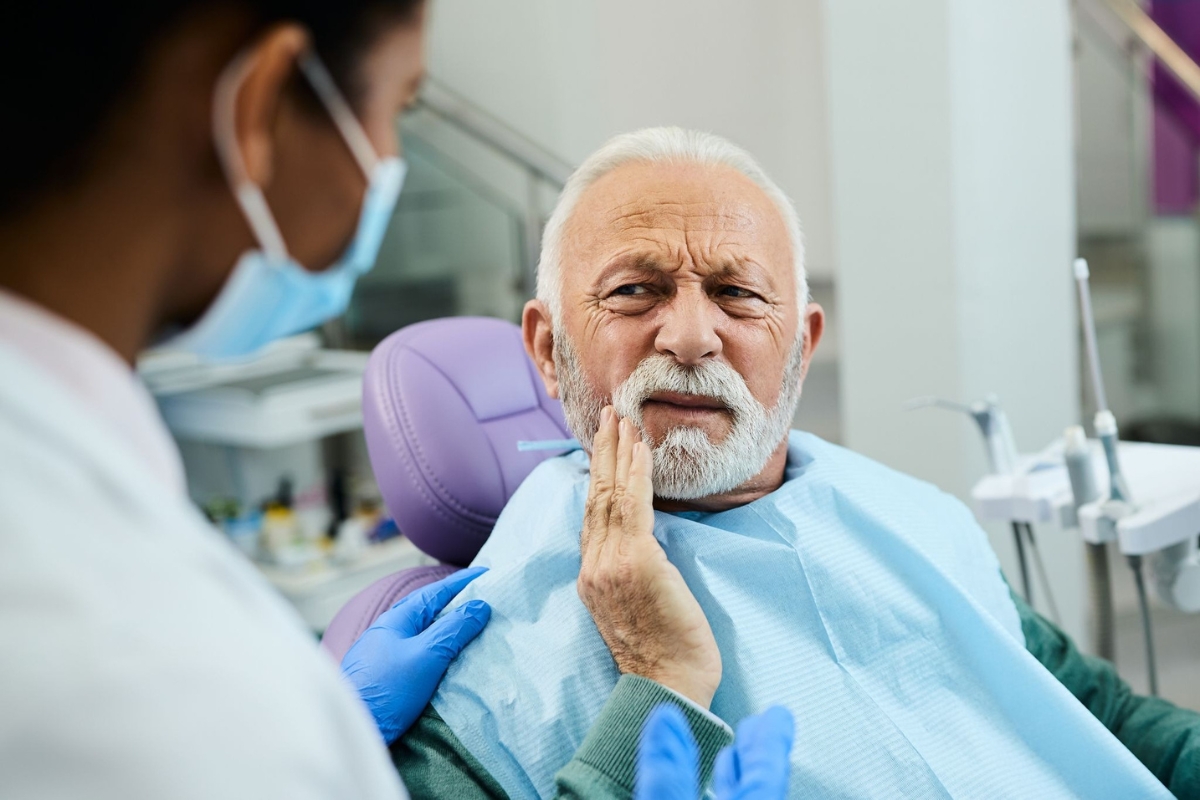 Dentist discussing missing tooth replacement options with a patient in Round Rock, TX